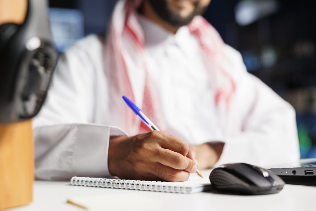 Man preparing event safety notes for Civil Defence Approval for Events in UAE